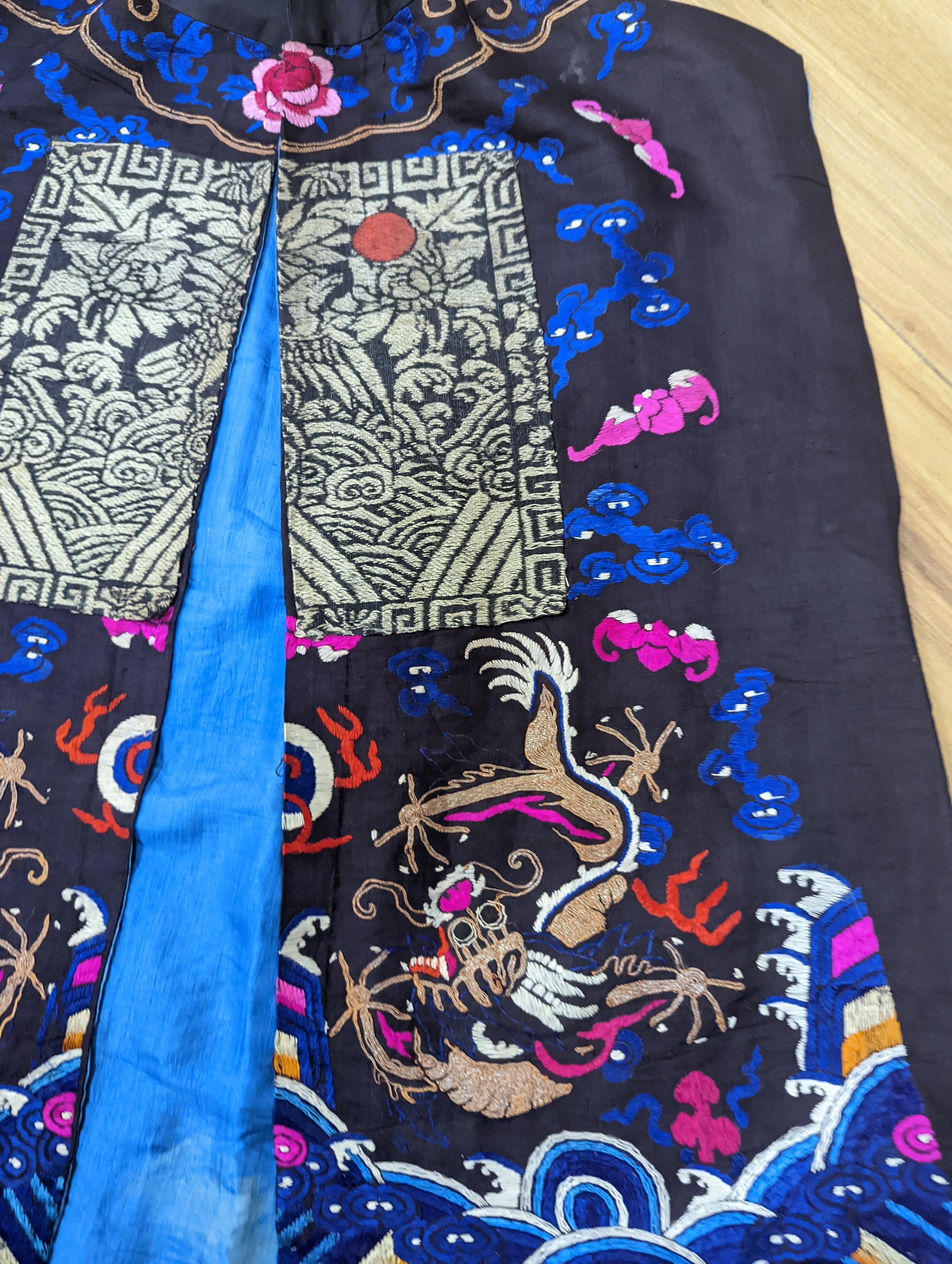 A 1920's Chinese dragon embroidered waistcoat, a cream silk drawn thread dress and a silk crepe black and patterned reversible kimono (3 items).